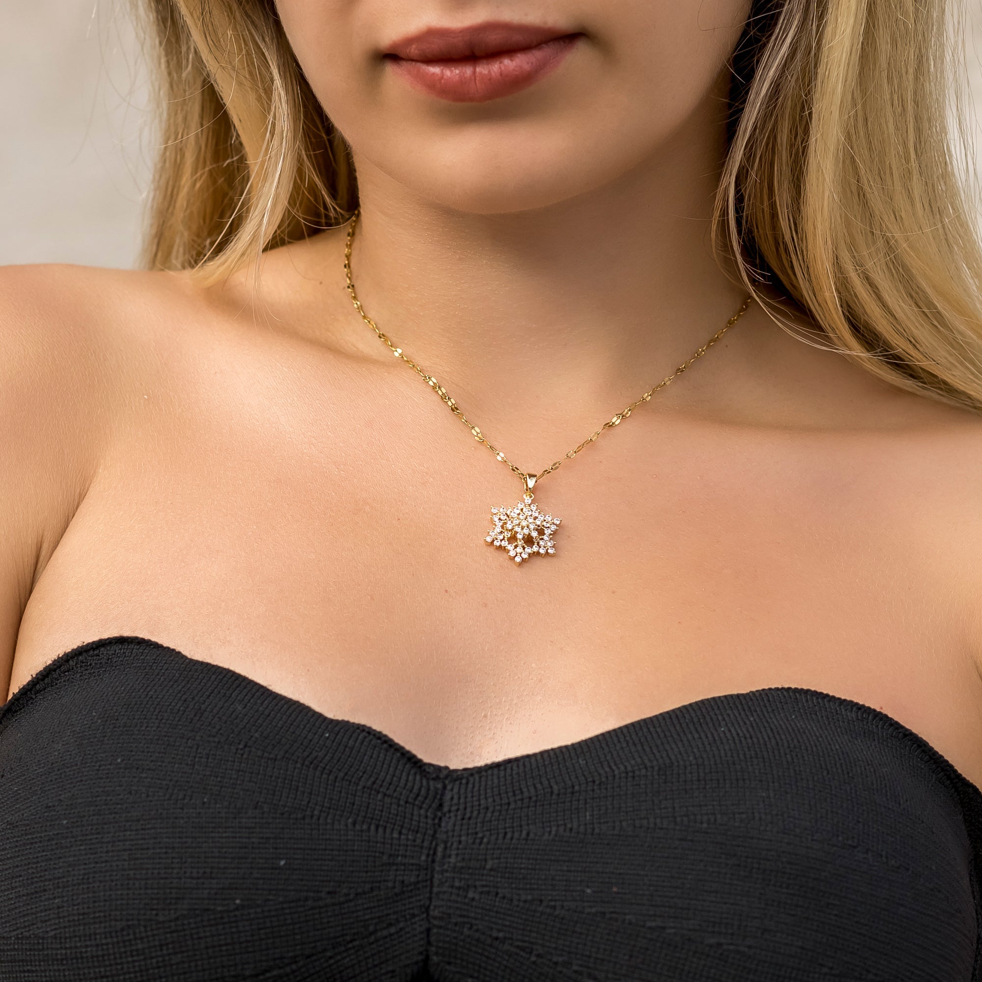 Gold Snowflake Spinning Pendant Necklace Vertical London Jewellery