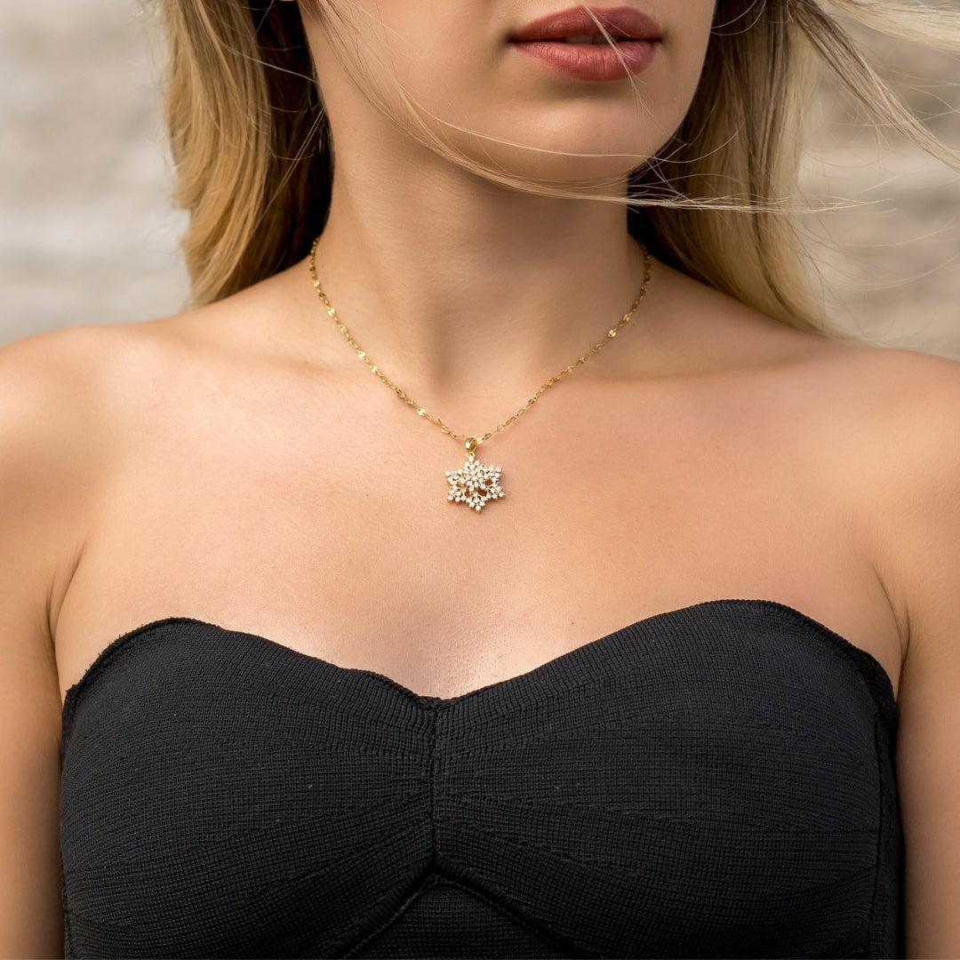 Gold Snowflake Spinning Pendant Necklace Vertical London Jewellery